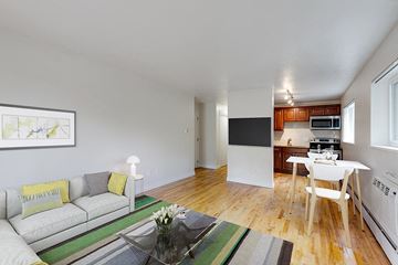 Denver apartment for rent - a living room with a couch and a table