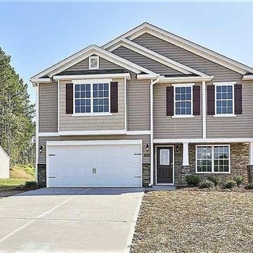 Clayton house for rent - A two-story house with a garage and a driveway.