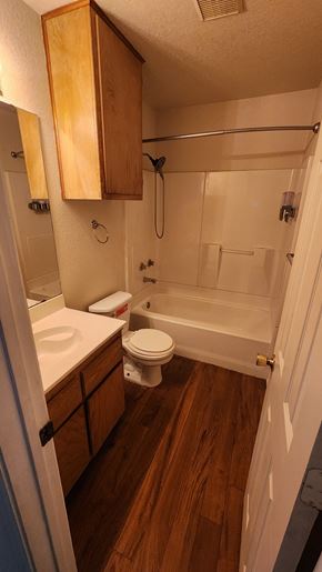 Copperas Cove apartment for rent - A small bathroom with a toilet, sink, and bathtub.