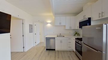 Los Angeles apartment for rent - A kitchen with white cabinets and stainless steel appliances.