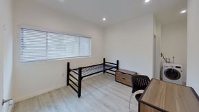 Los Angeles apartment for rent - A room with a washing machine and a bed.