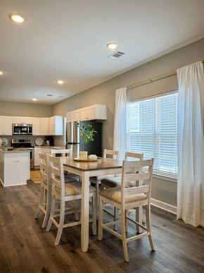 Little Rock house for rent - A dining room with a table set for four.