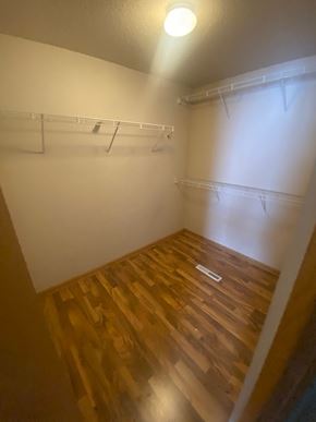 Moorhead apartment for rent - A small room with a wooden floor and white walls.
