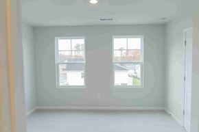Apex house for rent - A room with two windows and a white ceiling.
