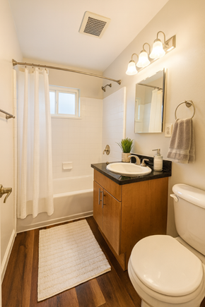 San Jose apartment for rent - A bathroom with a toilet, sink, and shower.