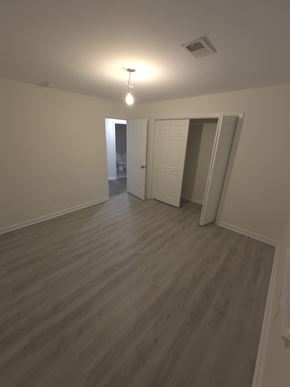 Smyrna house for rent - A room with a light on and a door at the end.