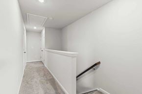 Apex house for rent - A hallway with a carpeted floor and white walls.