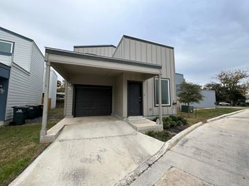 San Antonio house for rent - A modern house with a garage door entrance.
