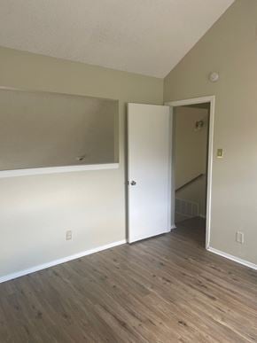 San Angelo house for rent - A room with a white door and wooden flooring.