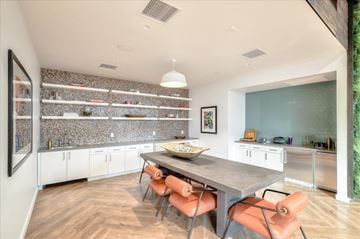 Oakland apartment for rent - A modern kitchen with a dining table and chairs.