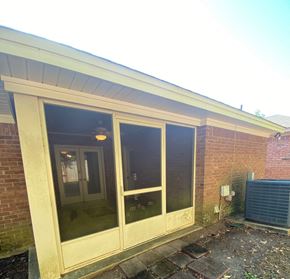 Montgomery house for rent - A sunny day with a building having a glass door and a window.