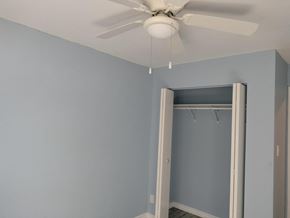 Gary house for rent - A room with a ceiling fan and a closet.
