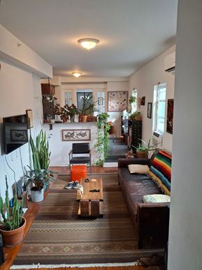 Philadelphia apartment for rent - A living room with a couch, a table, and a TV.