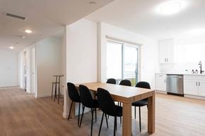Los Angeles apartment for rent - A dining table with four chairs is in the middle of a room.