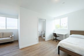Los Angeles apartment for rent - A bedroom with a bed, desk, and chair.