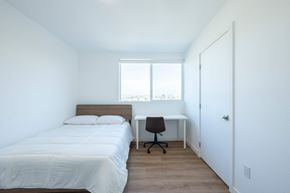 Los Angeles apartment for rent - A bedroom with a bed, desk, and chair.