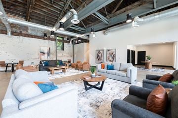 Columbus apartment for rent - A living room with a white couch and a coffee table.