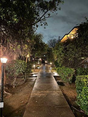 Fresno apartment for rent - A street with a lamp post on the left and a building on the right.
