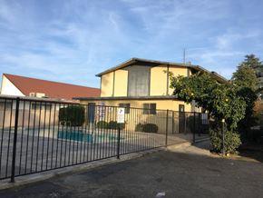 Fresno apartment for rent - A house with a pool in front of it.