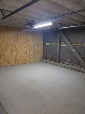 Hattiesburg house for rent - A large empty room with a light on the ceiling.