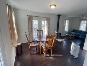 Hyampom house for rent - A room with a table and chairs in it.