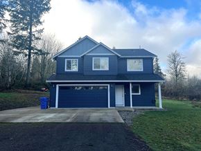 Kelso house for rent - A blue house with a white door and windows.