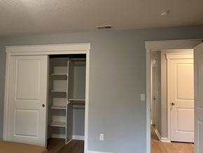 Kelso house for rent - A white door is open to a pantry with shelves.