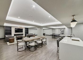 Ottawa apartment for rent - A modern kitchen with a dining table and chairs.