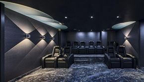Ottawa apartment for rent - A dark cinema room with rows of seats and spotlights.