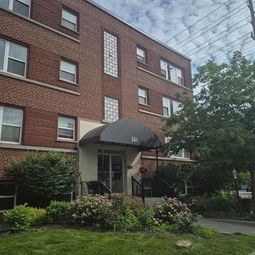 Ottawa apartment for rent - A brick building with a black awning and the number 341 on it.