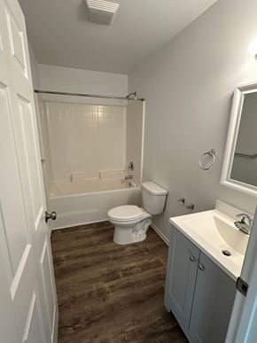 Granger apartment for rent - A white bathroom with a toilet, sink, and bathtub.