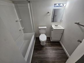 Lima house for rent - A white bathroom with a toilet, sink, and bathtub.