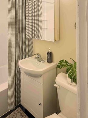 Winnipeg apartment for rent - A white sink in a bathroom with a mirror above it.