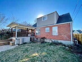 Louisville house for rent - A house with a red brick exterior and a covered patio.