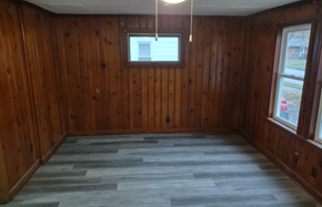Lima house for rent - A room with wooden walls and a window.