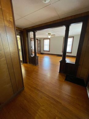 Lima house for rent - A long hallway with wood floors and a light on the ceiling.