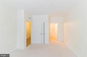 Phoenixville apartment for rent - A bright, empty room with white walls and a wooden floor.