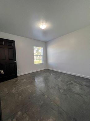 Grandview apartment for rent - A room with a dark brown cabinet and a window with blinds.