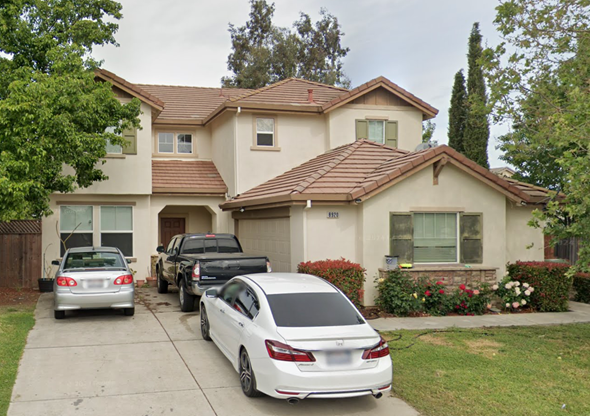 Elk Grove house for rent - A white car is parked in front of a house.