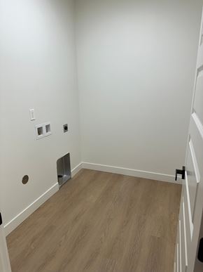 Benton City house for rent - A white wall with a small hole in it.