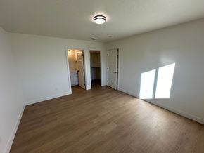 Benton City apartment for rent - A room with wooden flooring and white walls.