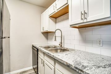 Arlington apartment for rent - A kitchen with a sink and cabinets.