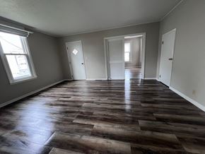 Wapakoneta house for rent - A room with wooden flooring and white walls.