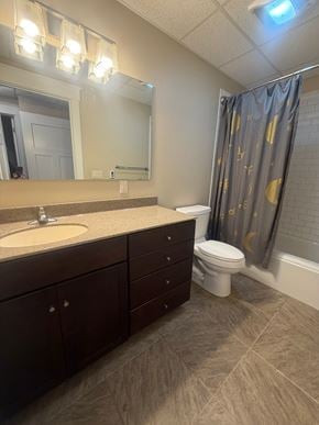 Grinnell apartment for rent - A bathroom with a sink, toilet, and a shower curtain.