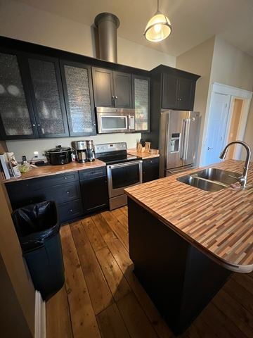 Grinnell apartment for rent - A kitchen with black cabinets and a wooden counter top.