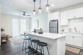 Deforest apartment for rent - Modern kitchen with quartz counter tops and stainless steal appliances located at Deforest Yards apartments in DeForest, WI