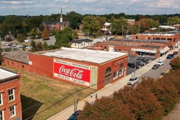 Mooresville apartment for rent - A Coca-Cola sign is on a building.