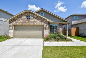 Katy house for rent - A house with a garage door and a driveway.