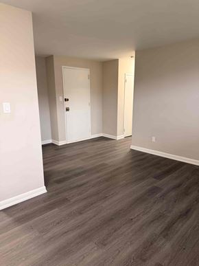 Toronto apartment for rent - A room with a white door and a grey floor.