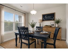 Hagerstown apartment for rent - A dining room with a table set for two and a sign that says "home is where we gather".